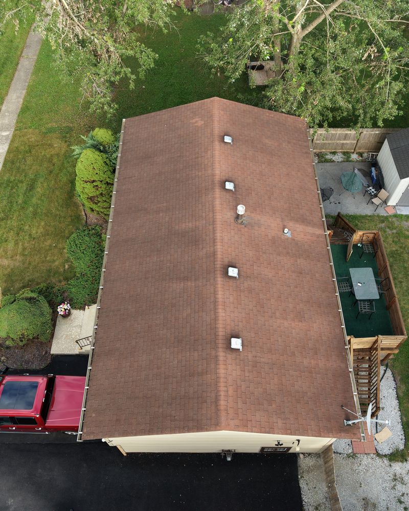Top-down FAA Part 107 drone aerial of a shingle roof for roofing and construction